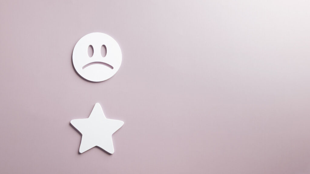 悲しい顔と星1つの低評価イメージ